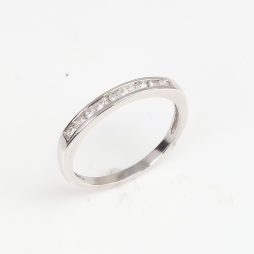 1393 - A modern unmarked white gold diamond half eternity ring, set with modern round brilliant-cut diamond... 