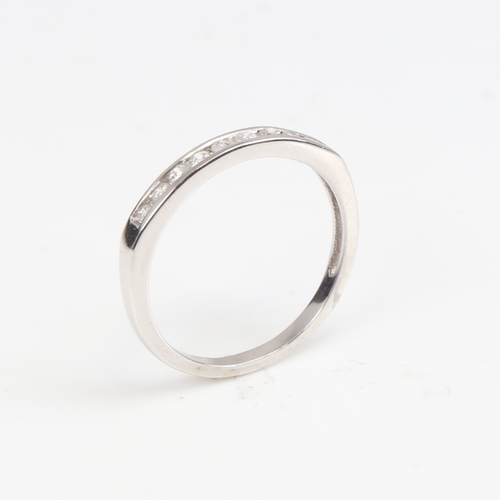 1393 - A modern unmarked white gold diamond half eternity ring, set with modern round brilliant-cut diamond... 