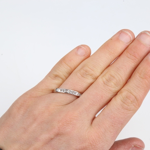 1393 - A modern unmarked white gold diamond half eternity ring, set with modern round brilliant-cut diamond... 