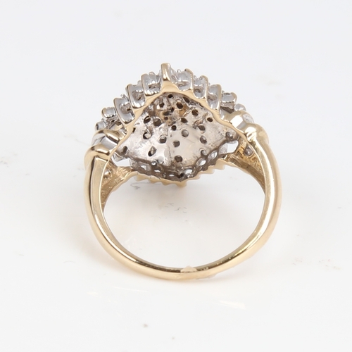 1403 - A modern 9ct gold diamond cluster cocktail ring, set with round brilliant and tapered baguette-cut d... 