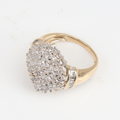 1403 - A modern 9ct gold diamond cluster cocktail ring, set with round brilliant and tapered baguette-cut d... 