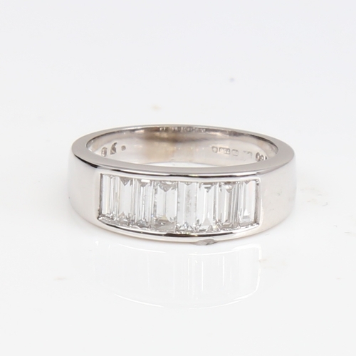 1405 - A modern 18ct white gold diamond quarter eternity ring, set with baguette-cut diamonds, total diamon... 