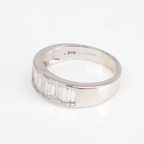 1405 - A modern 18ct white gold diamond quarter eternity ring, set with baguette-cut diamonds, total diamon... 