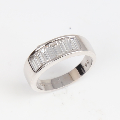 1405 - A modern 18ct white gold diamond quarter eternity ring, set with baguette-cut diamonds, total diamon... 