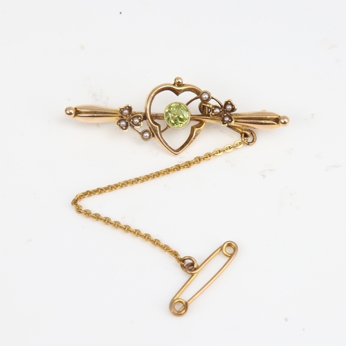 1406 - An early 20th century Art Nouveau 15ct gold peridot and split-pearl bar brooch, hallmarks Chester 19... 