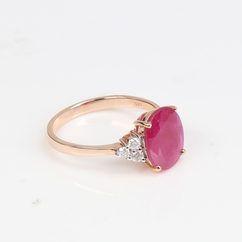 1418 - A modern 14ct rose gold ruby and diamond dress ring, set with oval mixed-cut ruby and round brillian... 