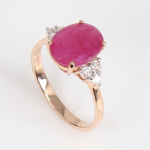 1418 - A modern 14ct rose gold ruby and diamond dress ring, set with oval mixed-cut ruby and round brillian... 