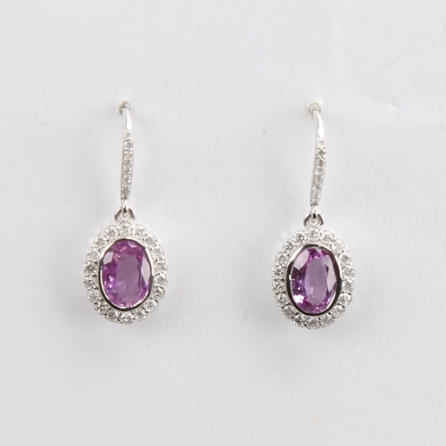 1423 - A modern pair of 14ct white gold pink sapphire and diamond cluster earrings, set with oval mixed-cut... 