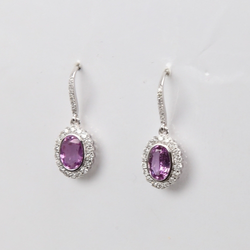 1423 - A modern pair of 14ct white gold pink sapphire and diamond cluster earrings, set with oval mixed-cut... 