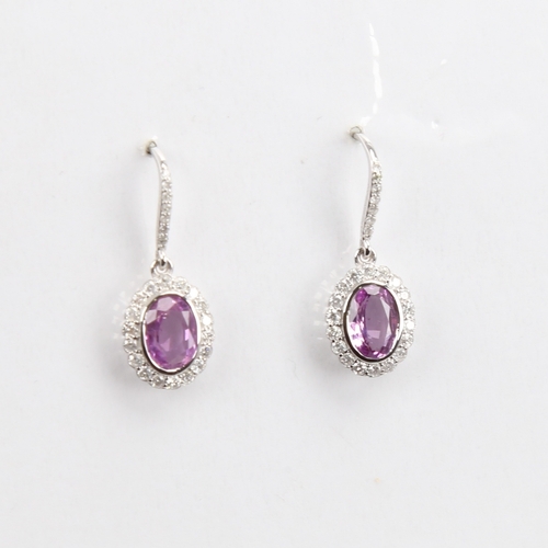 1423 - A modern pair of 14ct white gold pink sapphire and diamond cluster earrings, set with oval mixed-cut... 