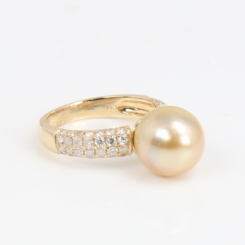 1426 - A modern 14ct gold whole cultured Southsea pearl and diamond dress ring, set with round brilliant-cu... 