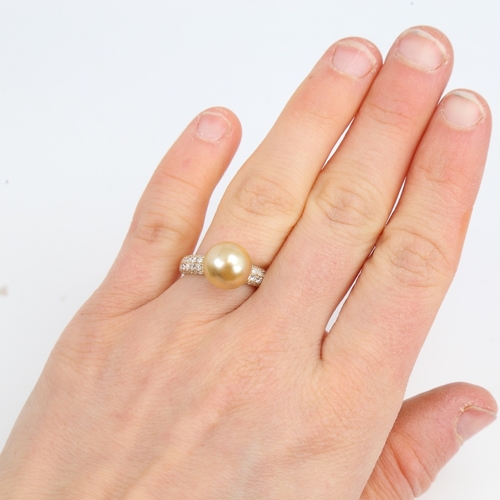 1426 - A modern 14ct gold whole cultured Southsea pearl and diamond dress ring, set with round brilliant-cu... 