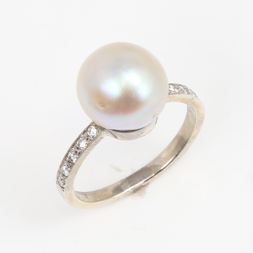 1428 - A 14ct white gold whole pearl and diamond ring, shoulders set with round brilliant-cut diamonds, pea... 