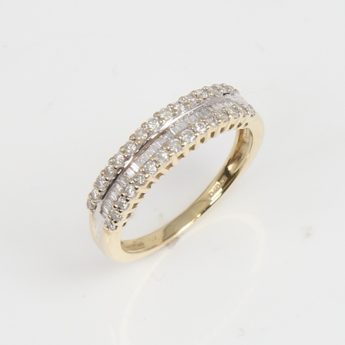 1432 - A modern 9ct gold diamond half hoop ring, set with modern round brilliant and baguette-cut diamonds,... 