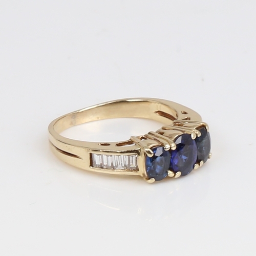 1437 - A modern 14ct gold sapphire and diamond dress ring, set with oval mixed-cut sapphires and baguette-c... 