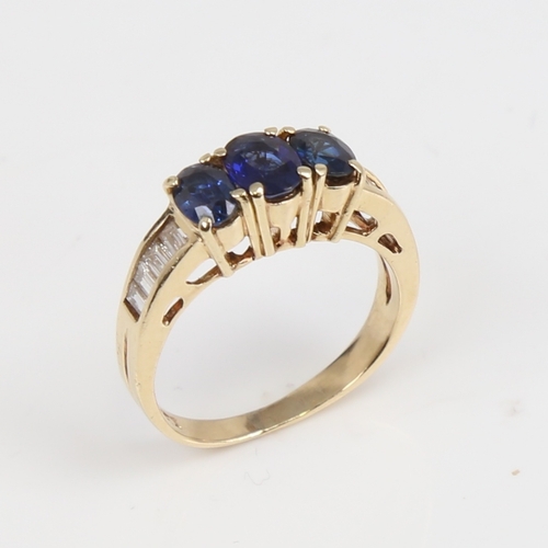 1437 - A modern 14ct gold sapphire and diamond dress ring, set with oval mixed-cut sapphires and baguette-c... 