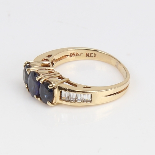 1437 - A modern 14ct gold sapphire and diamond dress ring, set with oval mixed-cut sapphires and baguette-c... 