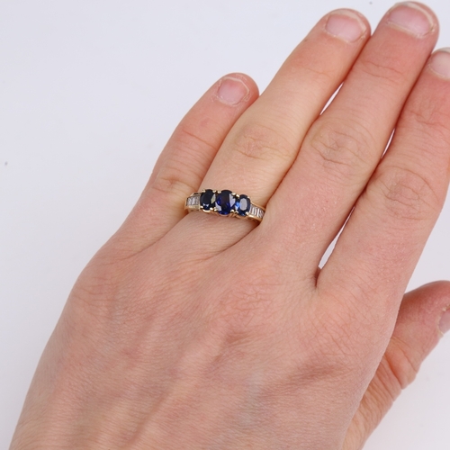 1437 - A modern 14ct gold sapphire and diamond dress ring, set with oval mixed-cut sapphires and baguette-c... 