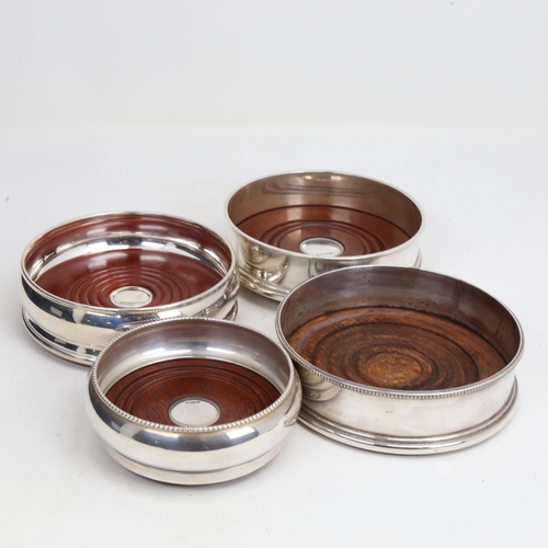 1444 - 4 Elizabeth II silver-mounted oak wine coasters, largest diameter 12.5cm (4)