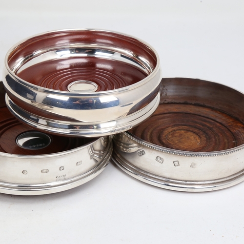 1444 - 4 Elizabeth II silver-mounted oak wine coasters, largest diameter 12.5cm (4)