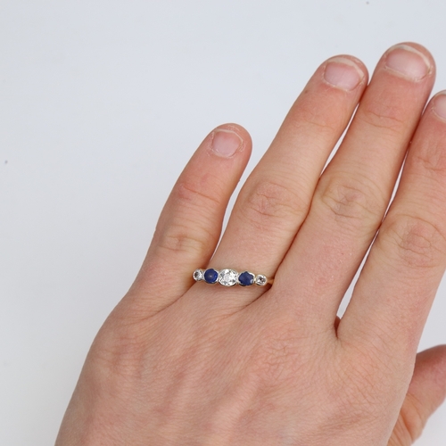 1446 - An early 20th century 18ct gold graduated 5-stone sapphire and diamond ring, platinum tops set with ... 