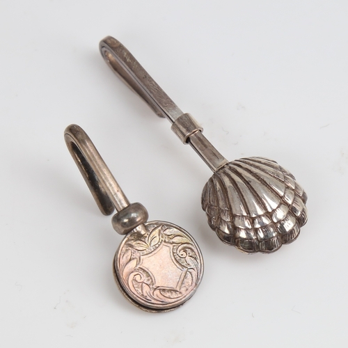 1449 - 2 silver napkin clips, including shell design, makers include G E Walton & Co Ltd with hallmarks Bir... 