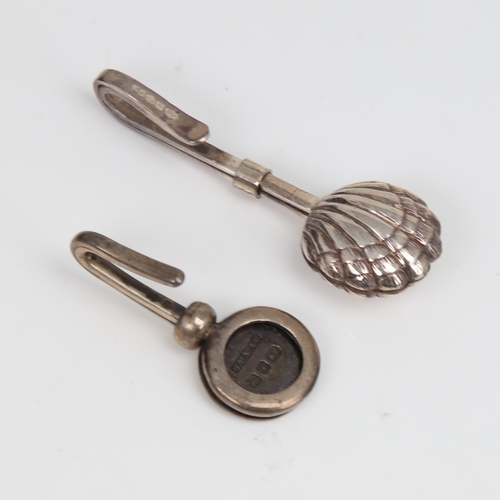 1449 - 2 silver napkin clips, including shell design, makers include G E Walton & Co Ltd with hallmarks Bir... 