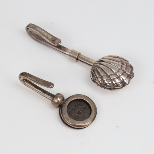 1449 - 2 silver napkin clips, including shell design, makers include G E Walton & Co Ltd with hallmarks Bir... 