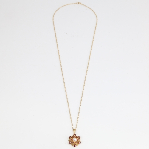 1453 - A late 20th century 9ct gold garnet and pearl floral pendant necklace, pendant height excluding bale... 