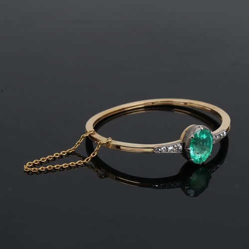 1455 - An Antique unmarked gold emerald and diamond hinged bracelet/bangle, set with 7.52ct oval mixed-cut ... 