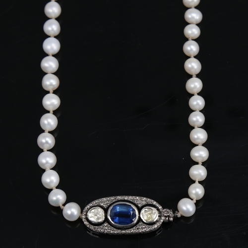 1458 - A long single-strand pearl necklace, with oxidised silver clasp set with oval mixed-cut kyanite and ... 