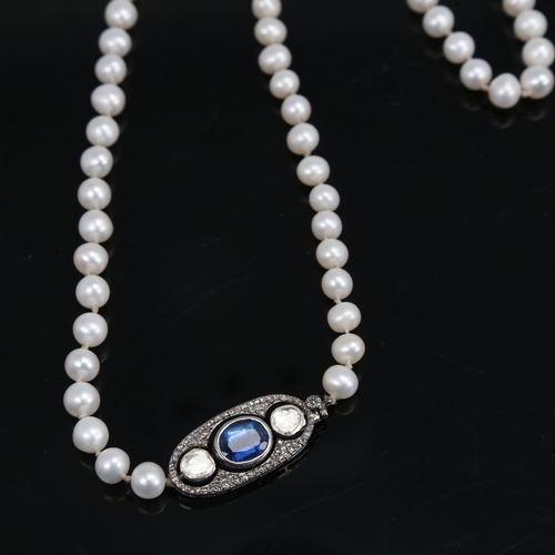 1458 - A long single-strand pearl necklace, with oxidised silver clasp set with oval mixed-cut kyanite and ... 