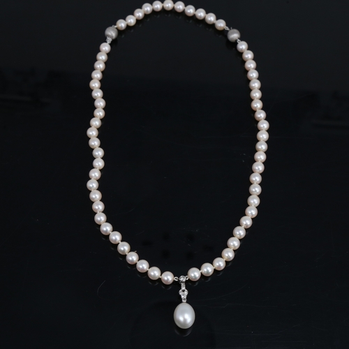 1459 - A Vintage single-strand pearl and diamond pendant necklace, with textured 14ct white gold clasps, to... 