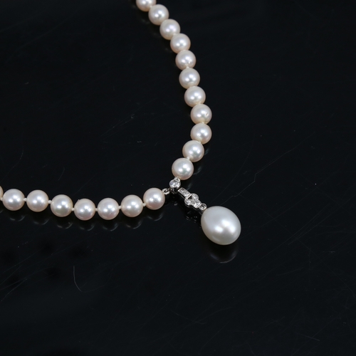 1459 - A Vintage single-strand pearl and diamond pendant necklace, with textured 14ct white gold clasps, to... 