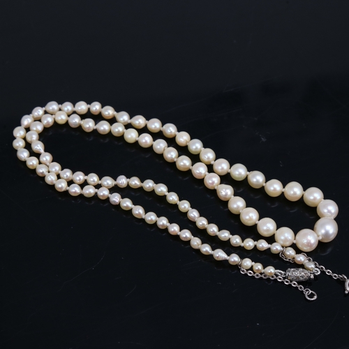 1460 - A single-strand graduated pearl necklace, with unmarked white metal rose-cut diamond set clasp, pear... 