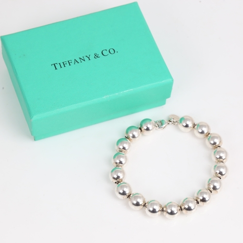 1473 - TIFFANY & CO - a modern sterling silver bead bracelet, bracelet length 18cm, 18.2g, boxed with gift ... 