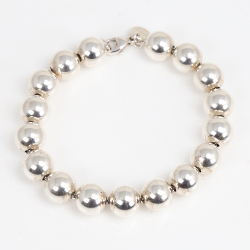 1473 - TIFFANY & CO - a modern sterling silver bead bracelet, bracelet length 18cm, 18.2g, boxed with gift ... 