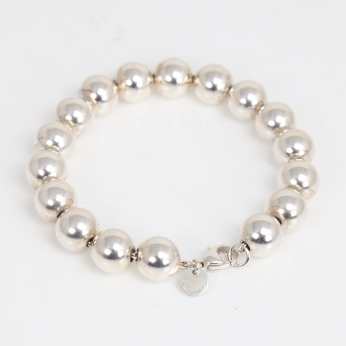 1473 - TIFFANY & CO - a modern sterling silver bead bracelet, bracelet length 18cm, 18.2g, boxed with gift ... 