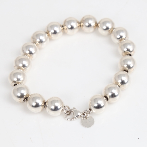 1473 - TIFFANY & CO - a modern sterling silver bead bracelet, bracelet length 18cm, 18.2g, boxed with gift ... 