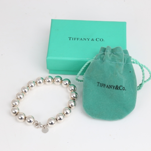 1473 - TIFFANY & CO - a modern sterling silver bead bracelet, bracelet length 18cm, 18.2g, boxed with gift ... 