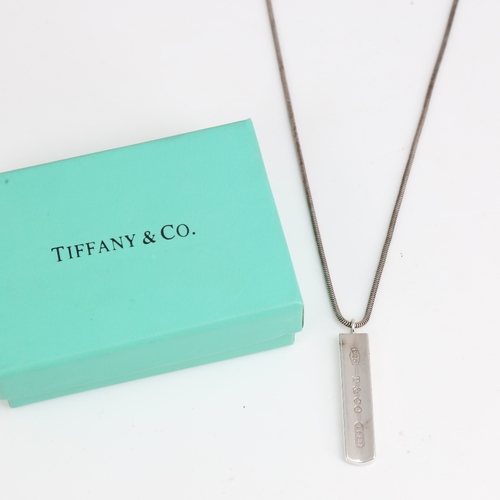 1474 - ELSA PERETTI for TIFFANY & CO - a sterling silver ingot pendant necklace, stamped 2001, with origina... 