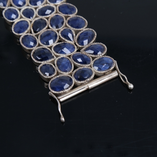 1475 - A heavy modern handmade unmarked silver sapphire cuff bracelet, organic form set with faceted caboch... 