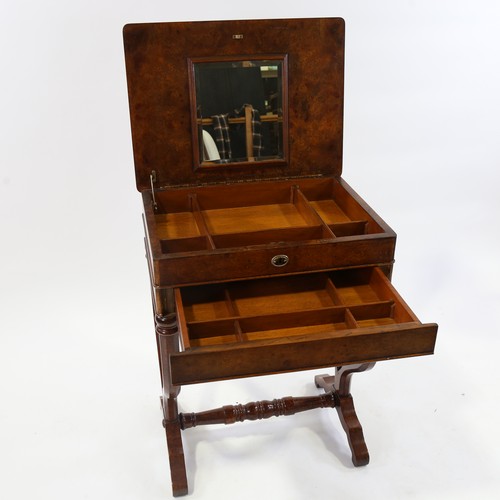 187 - A burr-walnut sewing table of rectangular form, with rising top single frieze drawer, raised on yoke... 