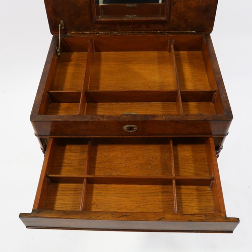 187 - A burr-walnut sewing table of rectangular form, with rising top single frieze drawer, raised on yoke... 