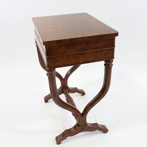 187 - A burr-walnut sewing table of rectangular form, with rising top single frieze drawer, raised on yoke... 