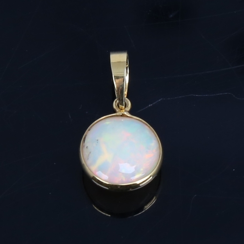 1484 - A modern handmade unmarked gold Ethiopian opal pendant, set with round cabochon opal, settings test ... 