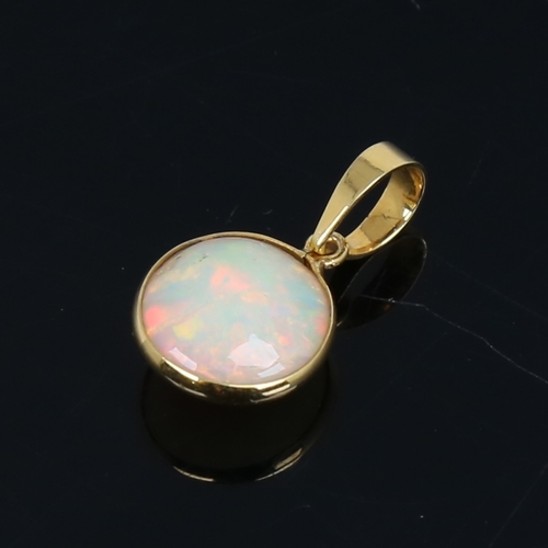 1484 - A modern handmade unmarked gold Ethiopian opal pendant, set with round cabochon opal, settings test ... 