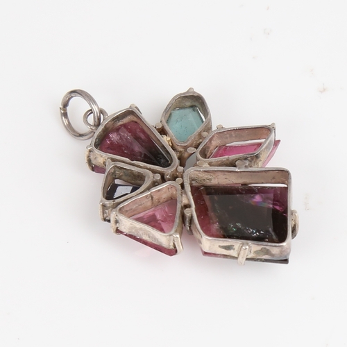 1485 - A modern handmade unmarked silver vari-hue tourmaline pendant, set with fantasy-cut tourmalines, pen... 