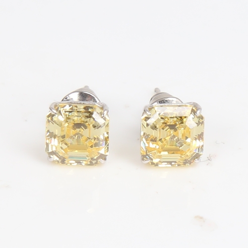 1487 - CARAT - a modern pair of 9ct white gold yellow asscher-cut cubic zirconia stud earrings, CZ width 7.... 