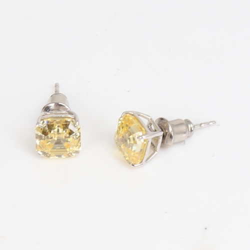 1487 - CARAT - a modern pair of 9ct white gold yellow asscher-cut cubic zirconia stud earrings, CZ width 7.... 